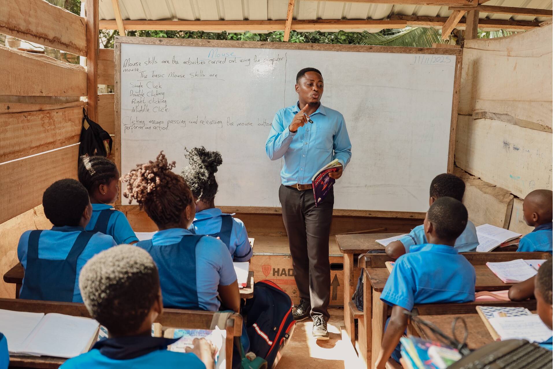 Rev. Mensah engaging learners during a classroom session.